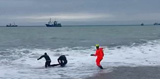 Located on the pier of tourists washed away by a wave in the Crimea