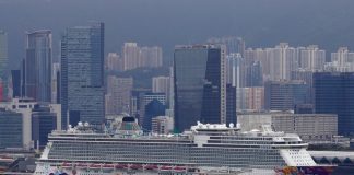 Passengers standing on a quarantine in Hong Kong the ship was allowed to leave the ship